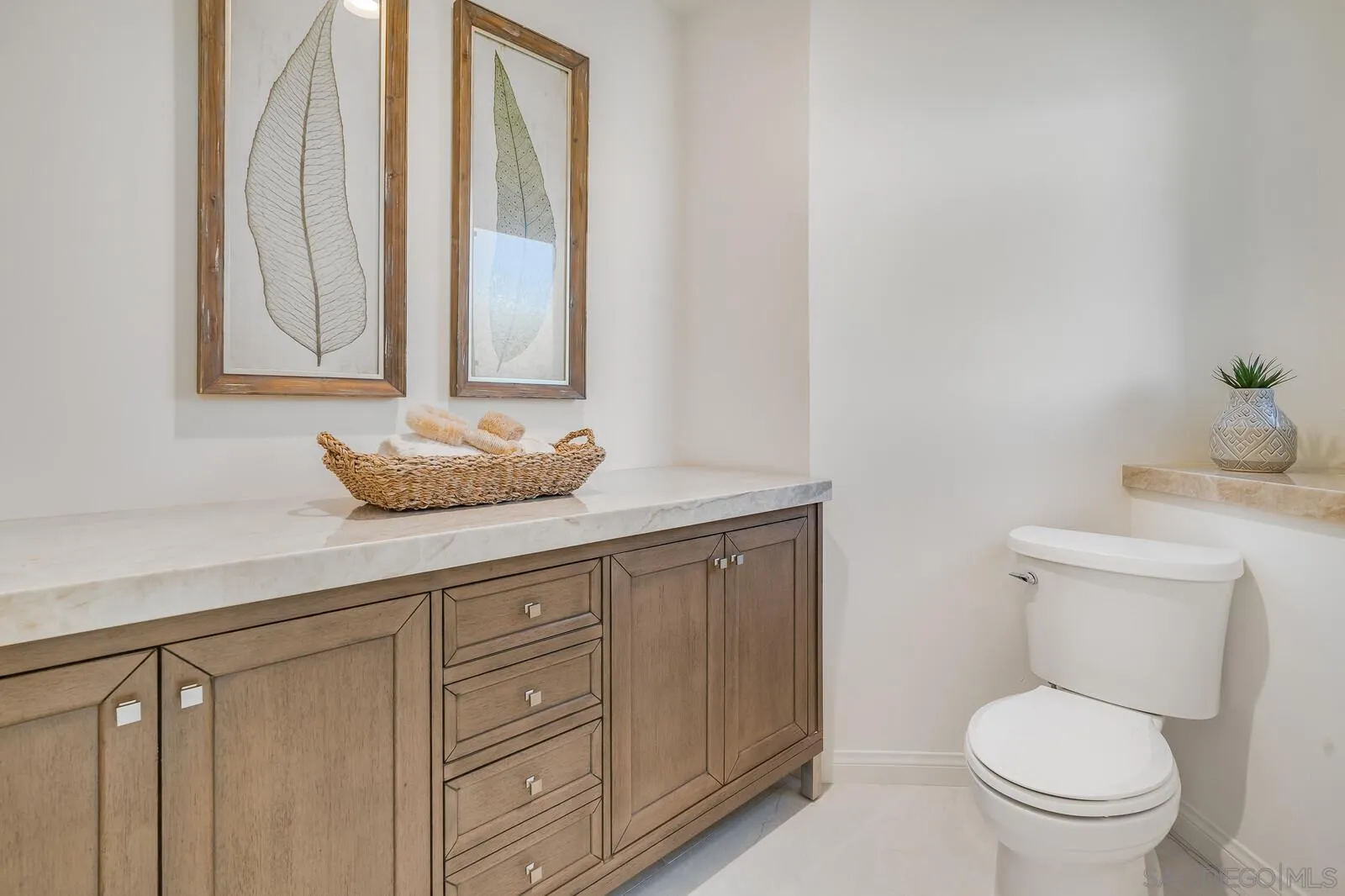 3620 Dove Hollow Road Encinitas, CA 92024 - Photo 34 of 75 a bathroom with a granite countertop toilet sink and mirror
