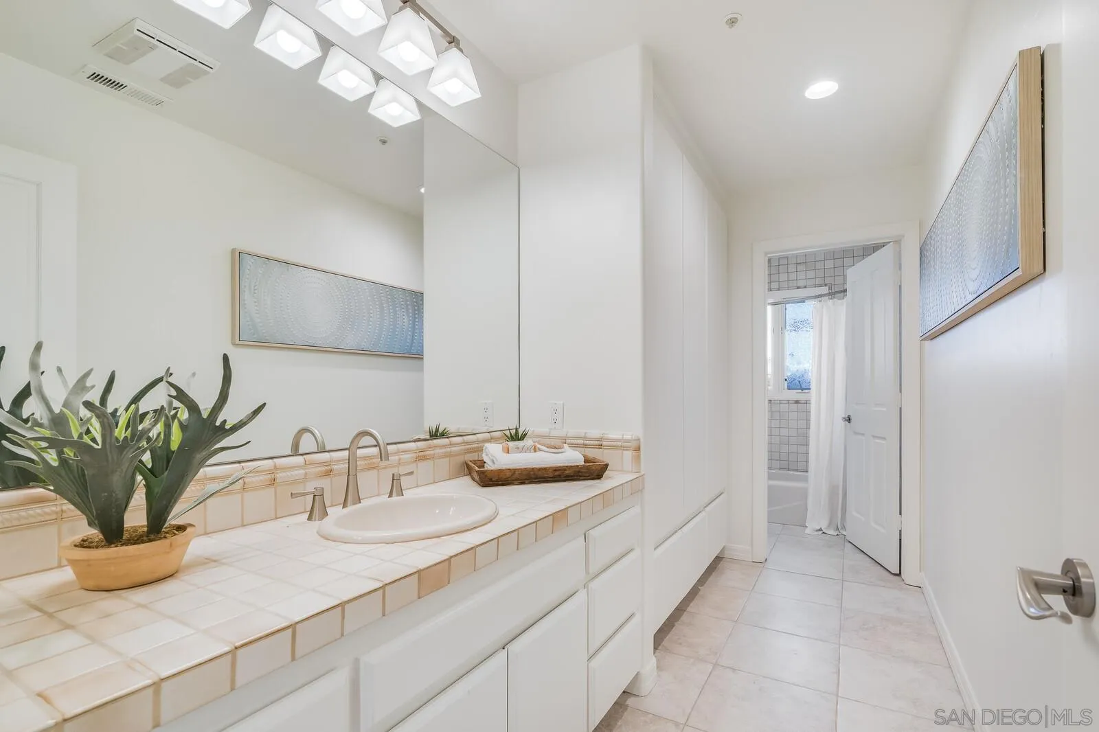 3620 Dove Hollow Road Encinitas, CA 92024 - Photo 41 of 75 a bathroom with a double vanity sink and a