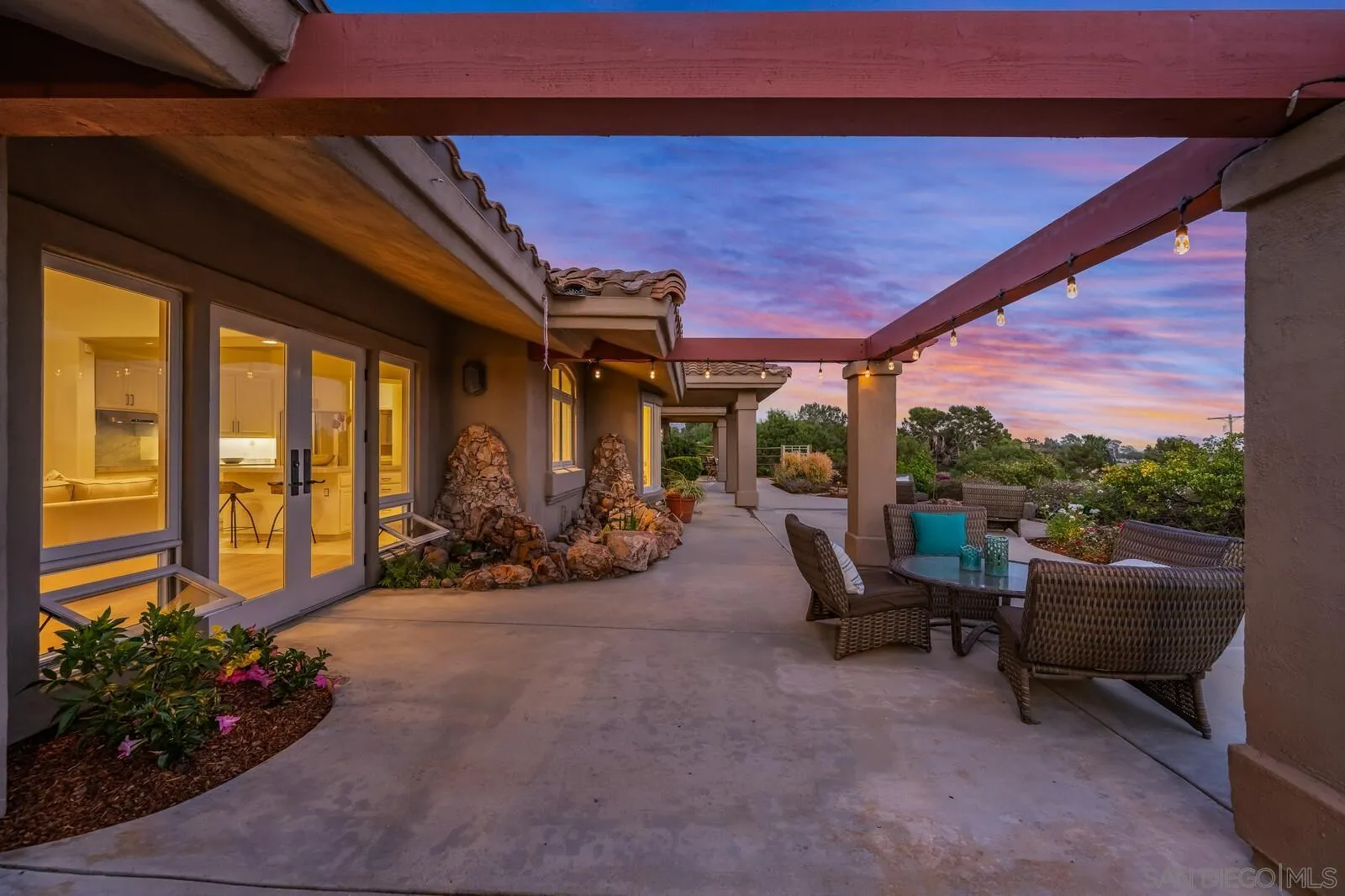 3620 Dove Hollow Road Encinitas, CA 92024 - Photo 57 of 75 a view of a patio with chairs and potted plants