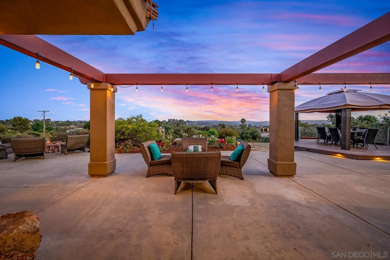 3620 Dove Hollow Road Encinitas, CA 92024 - Photo 58 of 75 a view of a patio with a table and chairs