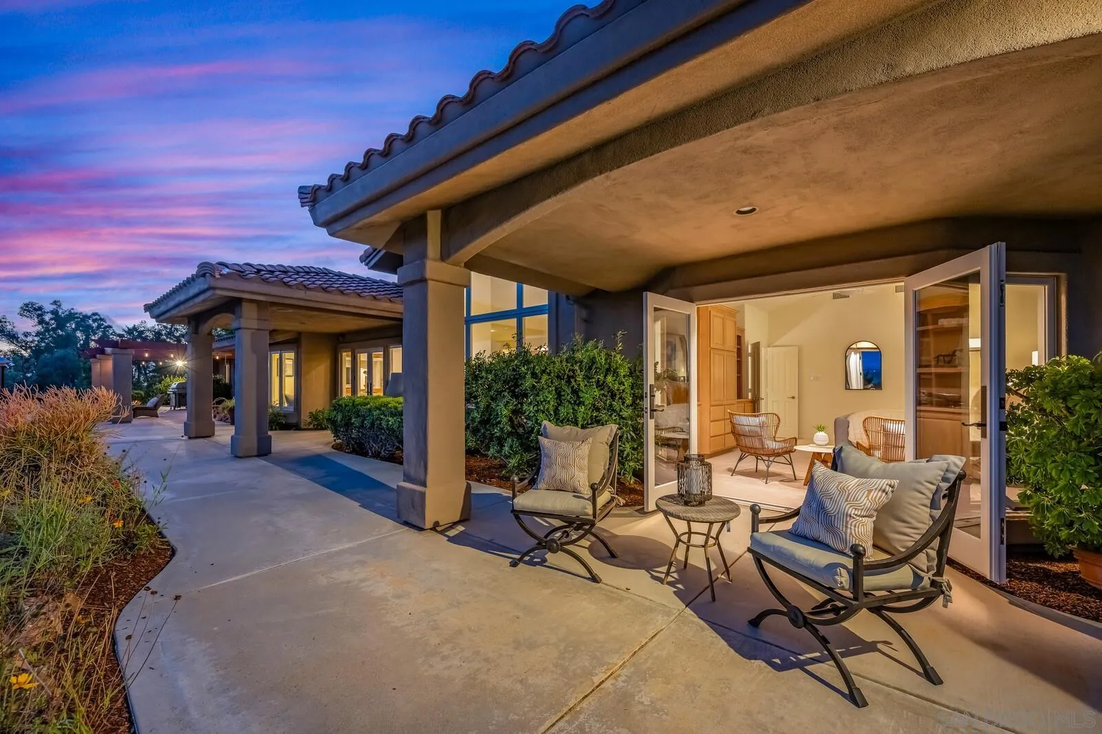 3620 Dove Hollow Road Encinitas, CA 92024 - Photo 62 of 75 a view of patio with a table and chairs and potted plants