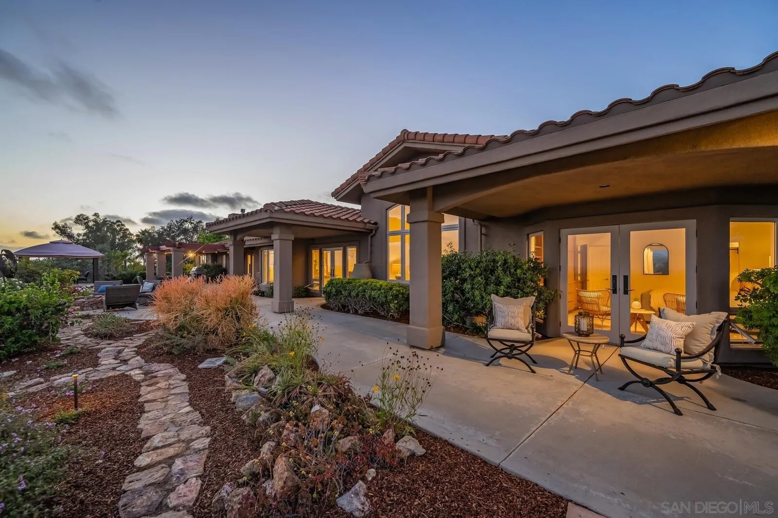 3620 Dove Hollow Road Encinitas, CA 92024 - Photo 63 of 75 a view of a house with backyard sitting area and garden