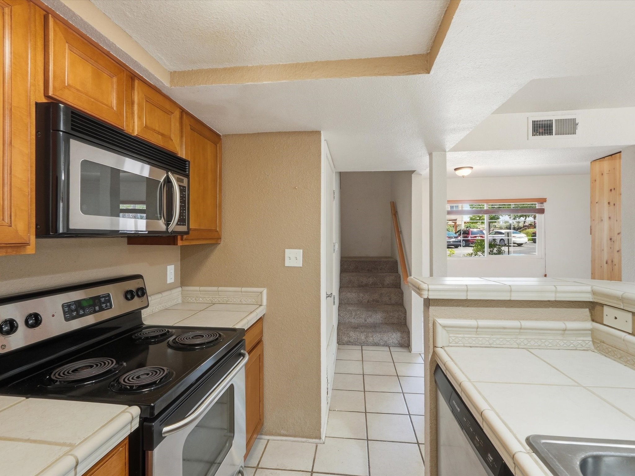 2210 Miguel Chavez Road, Unit 411 Santa Fe, NM 87505 - Photo 17 of 59 From the kitchen, walk-through the stair going to the second floor of the unit