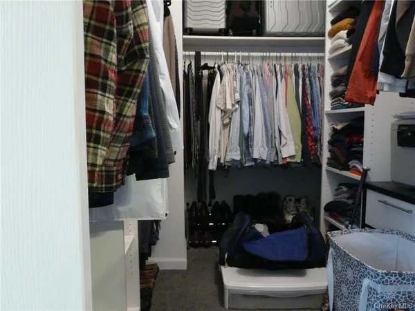 a bed room with a bed and chair