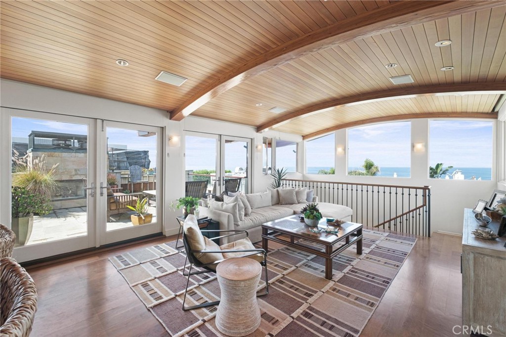 401 27th Street Manhattan Beach, CA 90266 - Photo 14 of 36 a living room with furniture and floor to ceiling windows