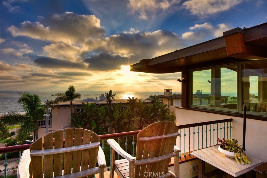 401 27th Street Manhattan Beach, CA 90266 - Photo 3 of 36 a view of a balcony with chair and wooden floor
