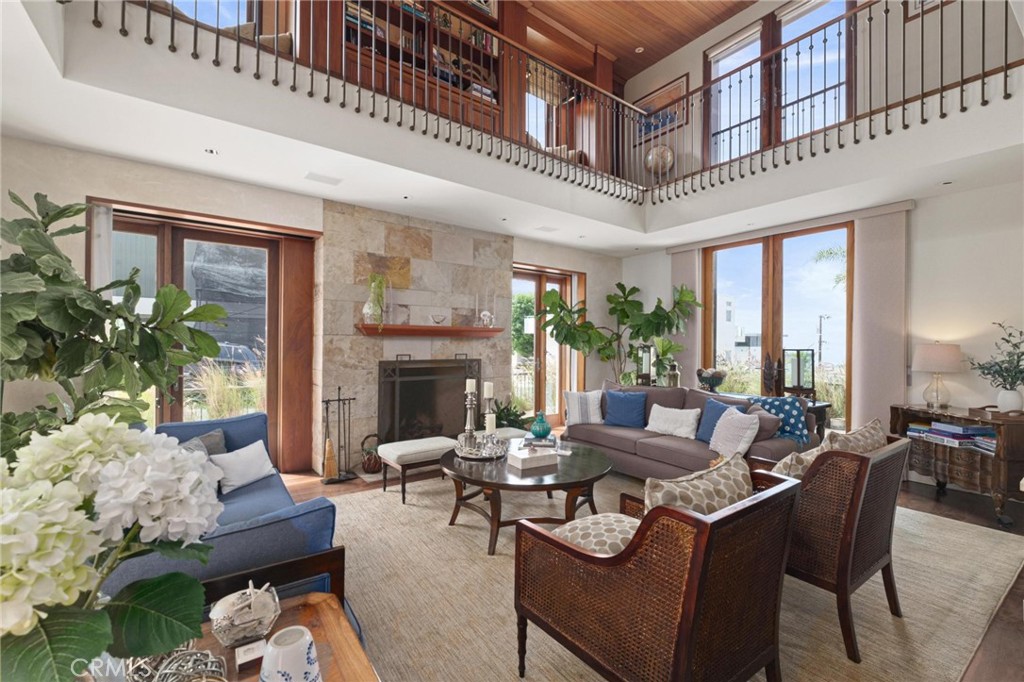 401 27th Street Manhattan Beach, CA 90266 - Photo 8 of 36 a living room with furniture and a fireplace