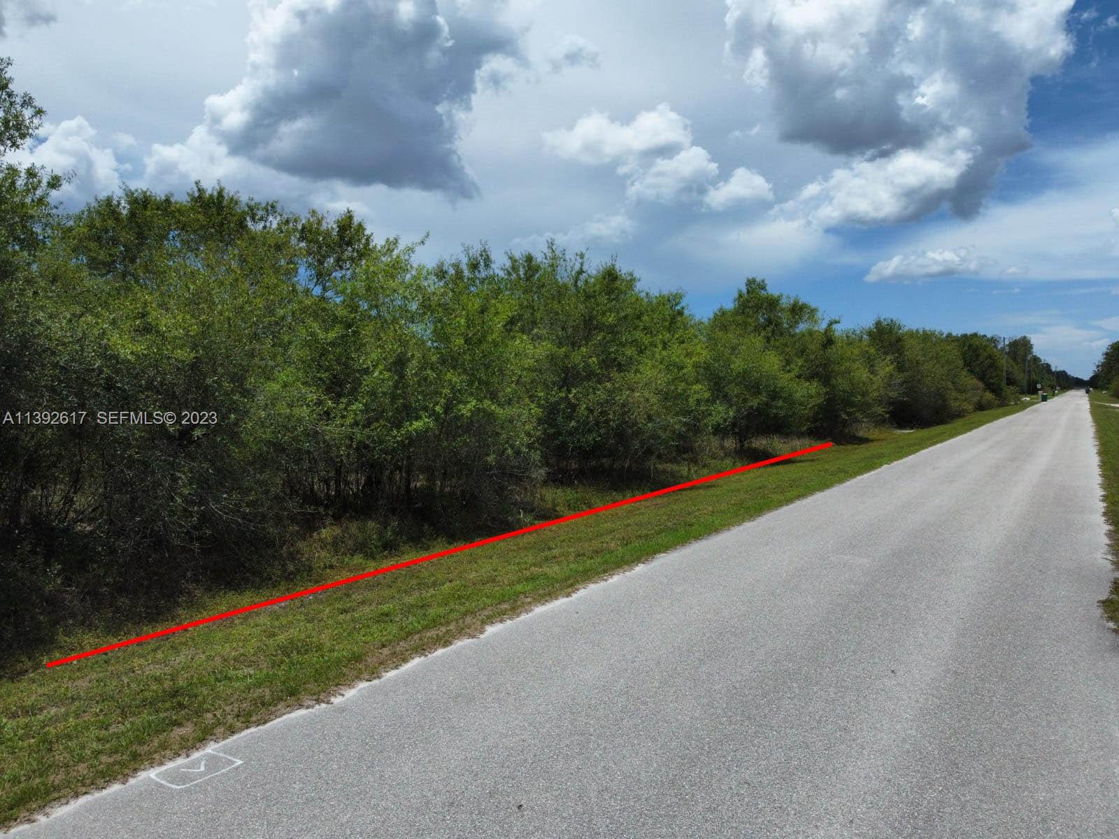 0 Th Naples, FL 34120 - Photo 2 of 6 a view of building with outdoor space