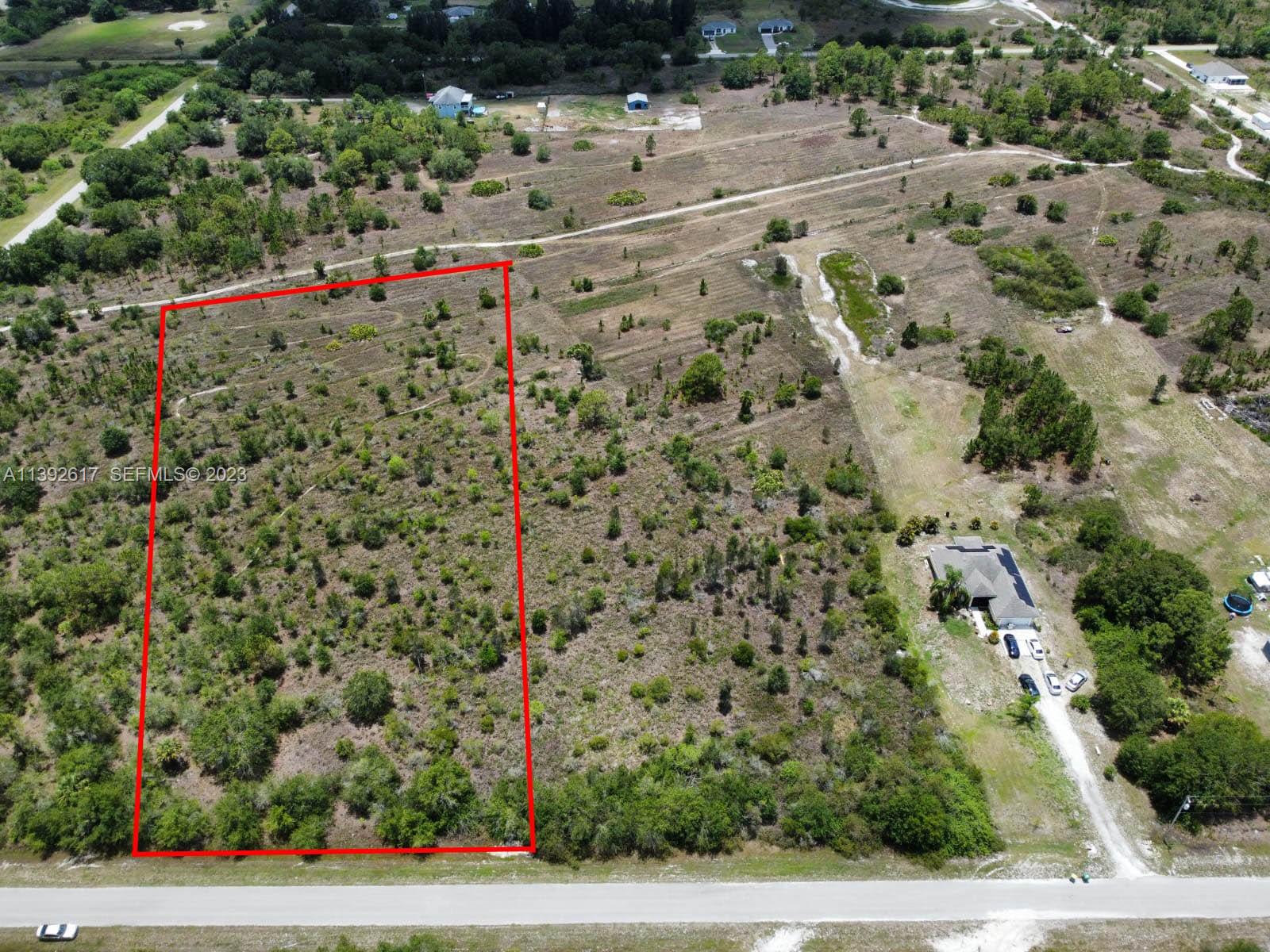 0 Th Naples, FL 34120 - Photo 4 of 6 an aerial view of a houses with a yard