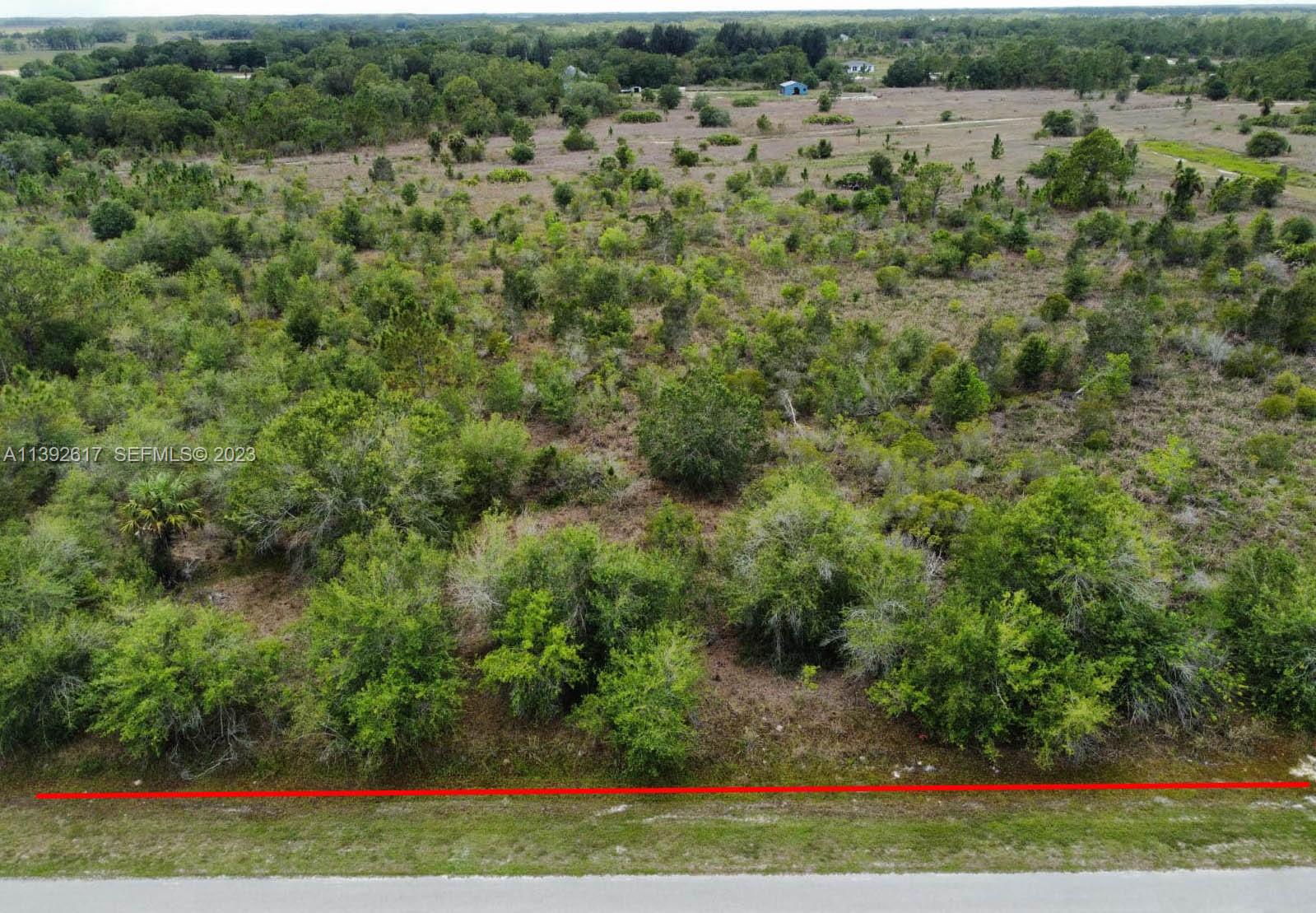 0 Th Naples, FL 34120 - Photo 6 of 6 an aerial view of residential houses with outdoor space and trees