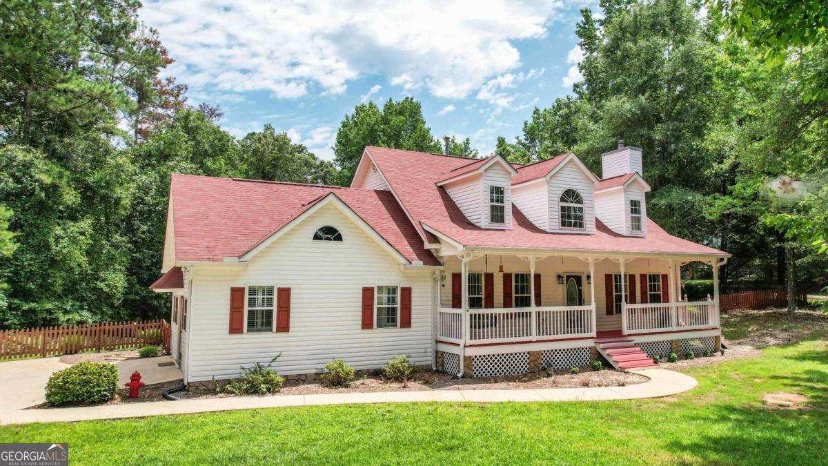 1334 Jim Starr Road Newnan, GA 30263 - Photo 1 of 1 a front view of a house with a yard