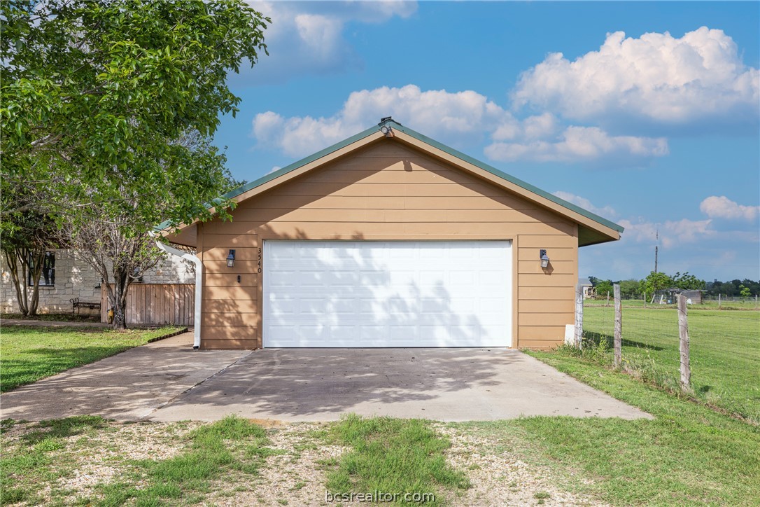 3540 Fisher Ranch Road Bryan, TX 77808 - Photo 19 of 36 a front view of a house with garden