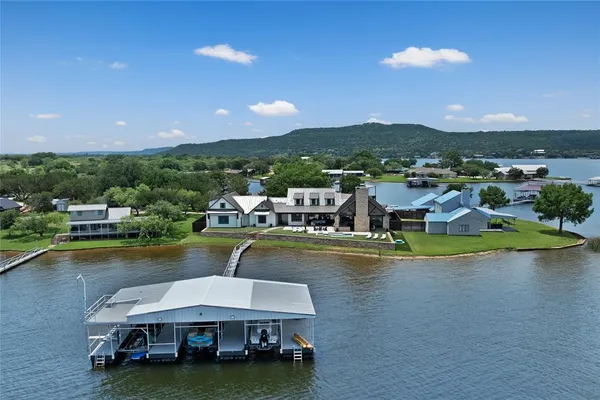 an aerial view of a house with a lake view