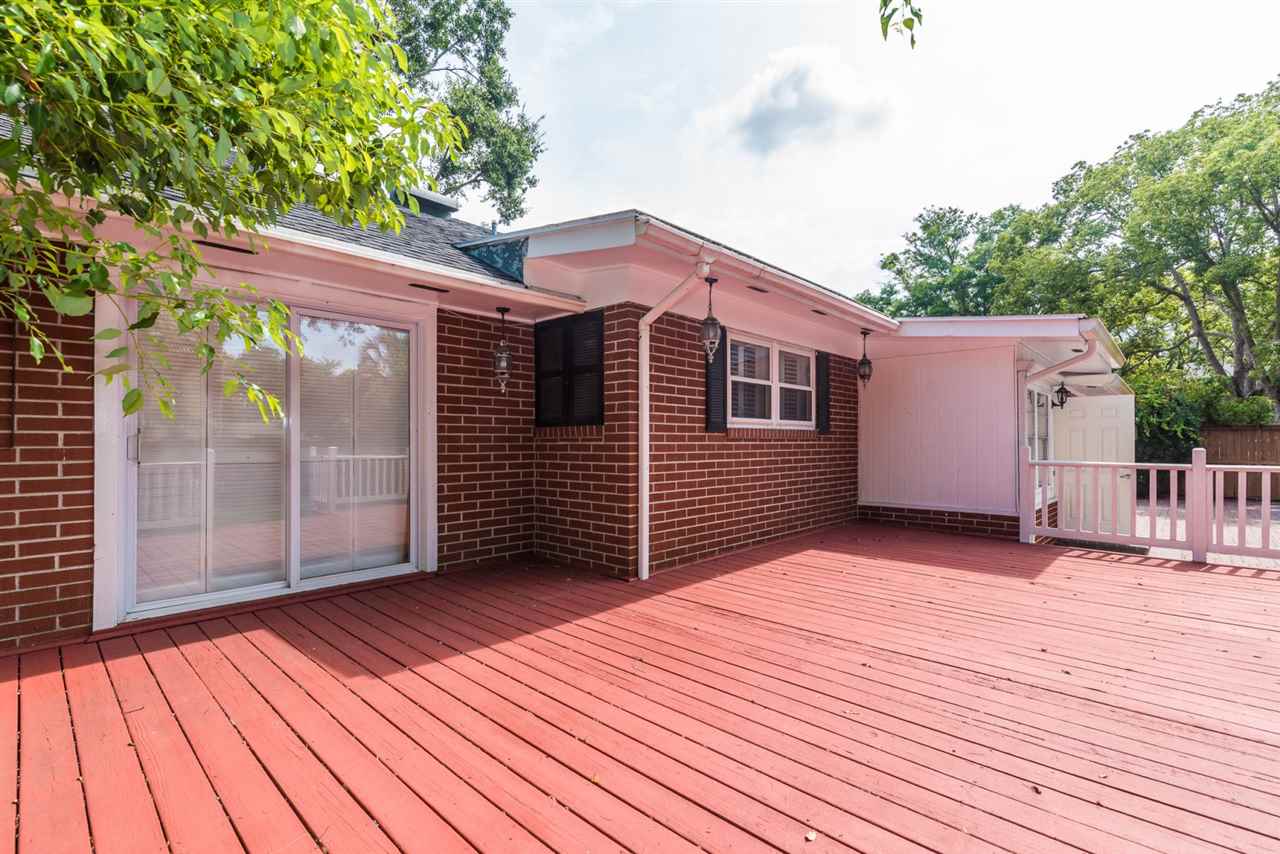 71 Valencia Street St. Augustine, FL 32084 - Photo 19 of 43 a view of a house with a wooden deck