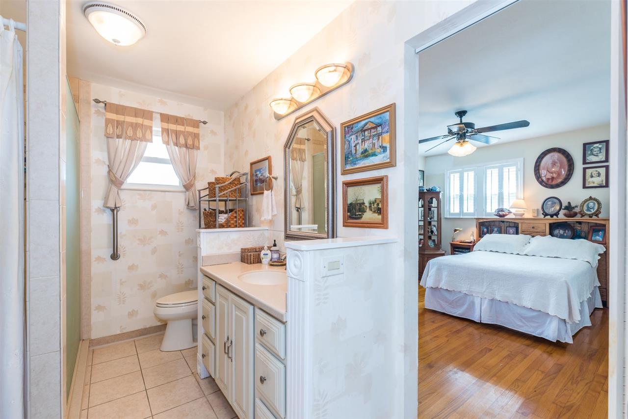 71 Valencia Street St. Augustine, FL 32084 - Photo 22 of 43 a bathroom with a double vanity sink mirror and toilet