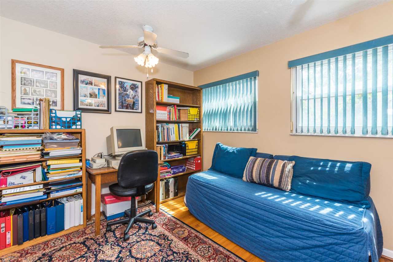 71 Valencia Street St. Augustine, FL 32084 - Photo 25 of 43 a workspace with furniture and book shelf