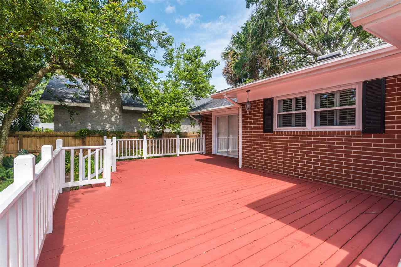 71 Valencia Street St. Augustine, FL 32084 - Photo 29 of 43 a view of backyard with deck and wooden floor