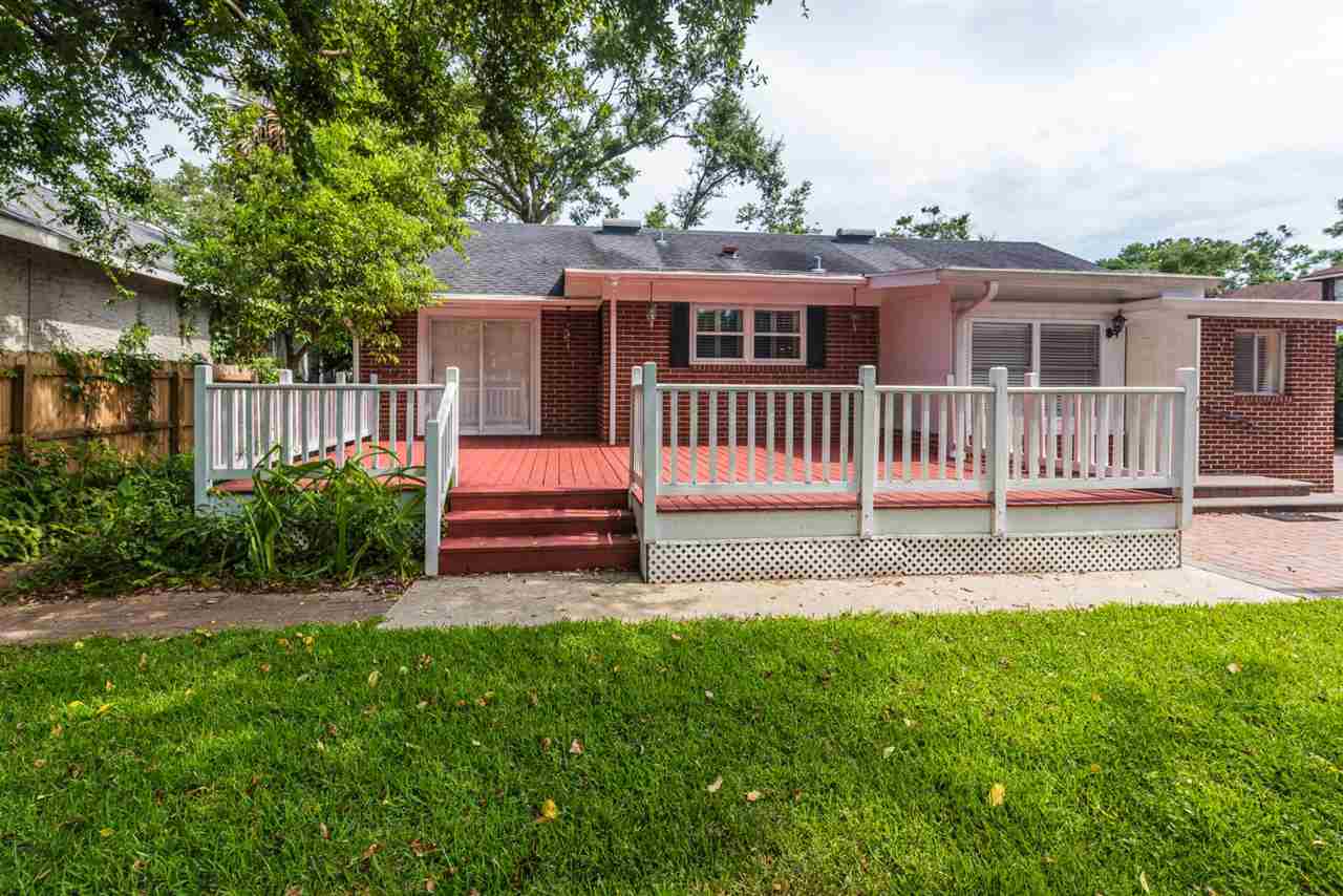 71 Valencia Street St. Augustine, FL 32084 - Photo 30 of 43 a front view of a house with a yard table and chairs