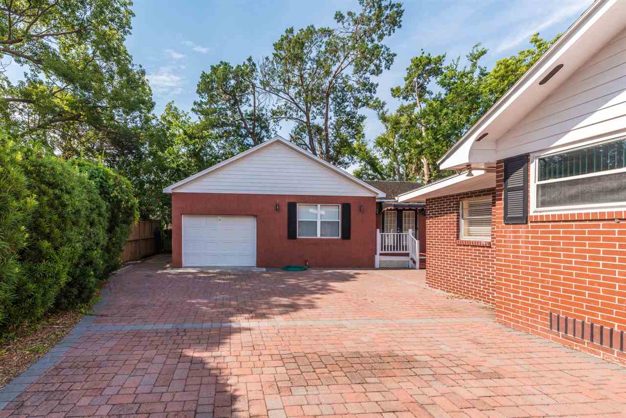 71 Valencia Street St. Augustine, FL 32084 - Photo 3 of 43 a front view of a house with a yard and garage