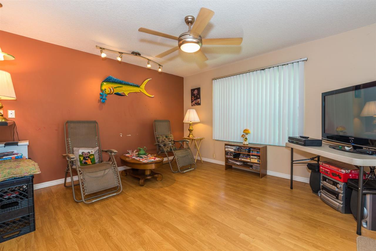 71 Valencia Street St. Augustine, FL 32084 - Photo 33 of 43 a living room with furniture and a flat screen tv