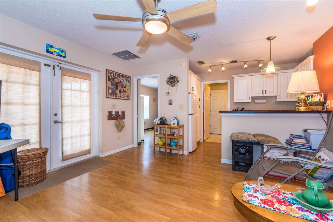 71 Valencia Street St. Augustine, FL 32084 - Photo 35 of 43 a living room with furniture and a wooden floor
