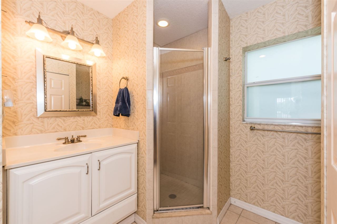 71 Valencia Street St. Augustine, FL 32084 - Photo 38 of 43 a bathroom with a sink vanity and mirror