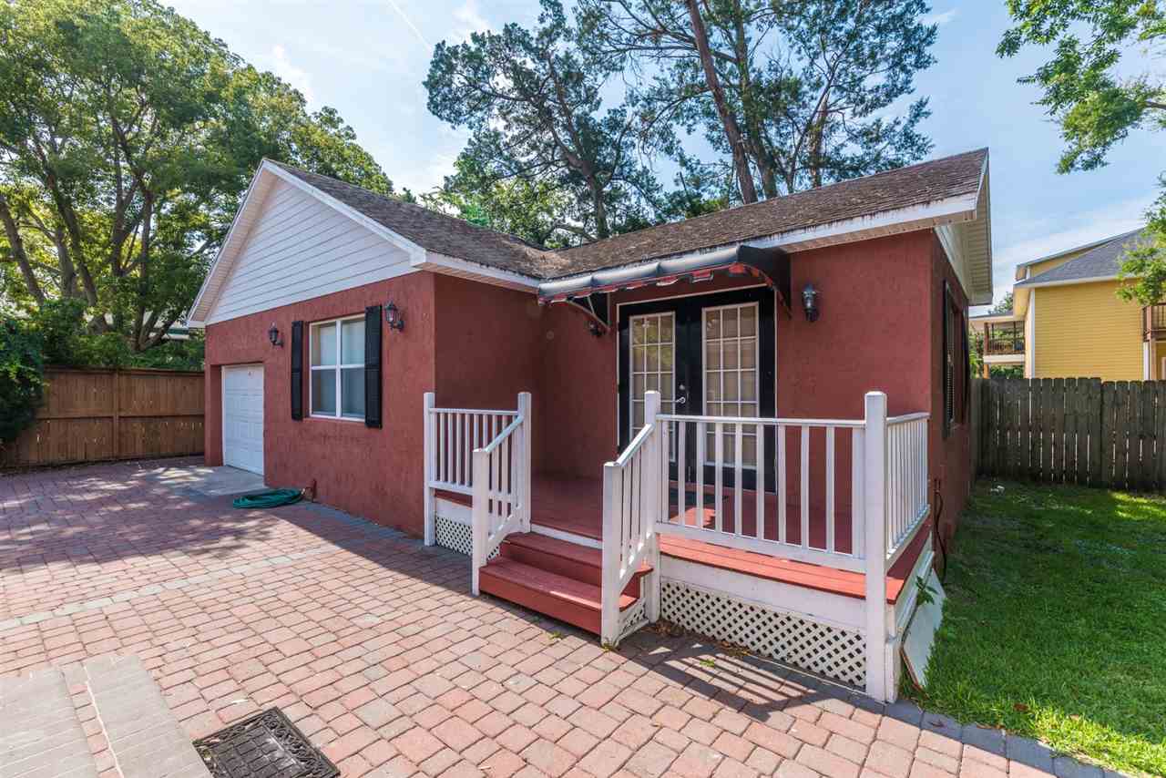 71 Valencia Street St. Augustine, FL 32084 - Photo 4 of 43 a view of a house with a yard and wooden fence