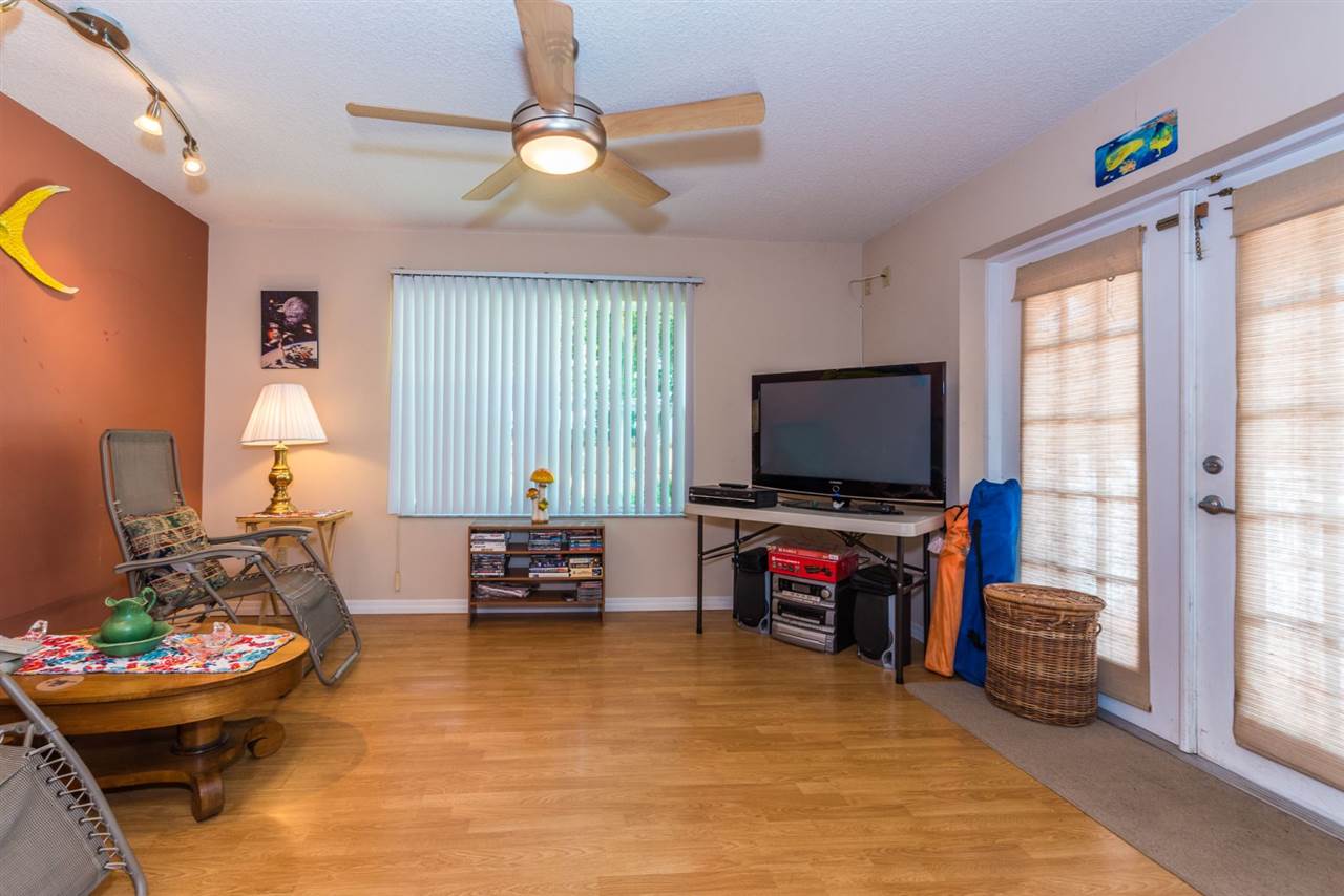71 Valencia Street St. Augustine, FL 32084 - Photo 41 of 43 a living room with furniture and a flat screen tv