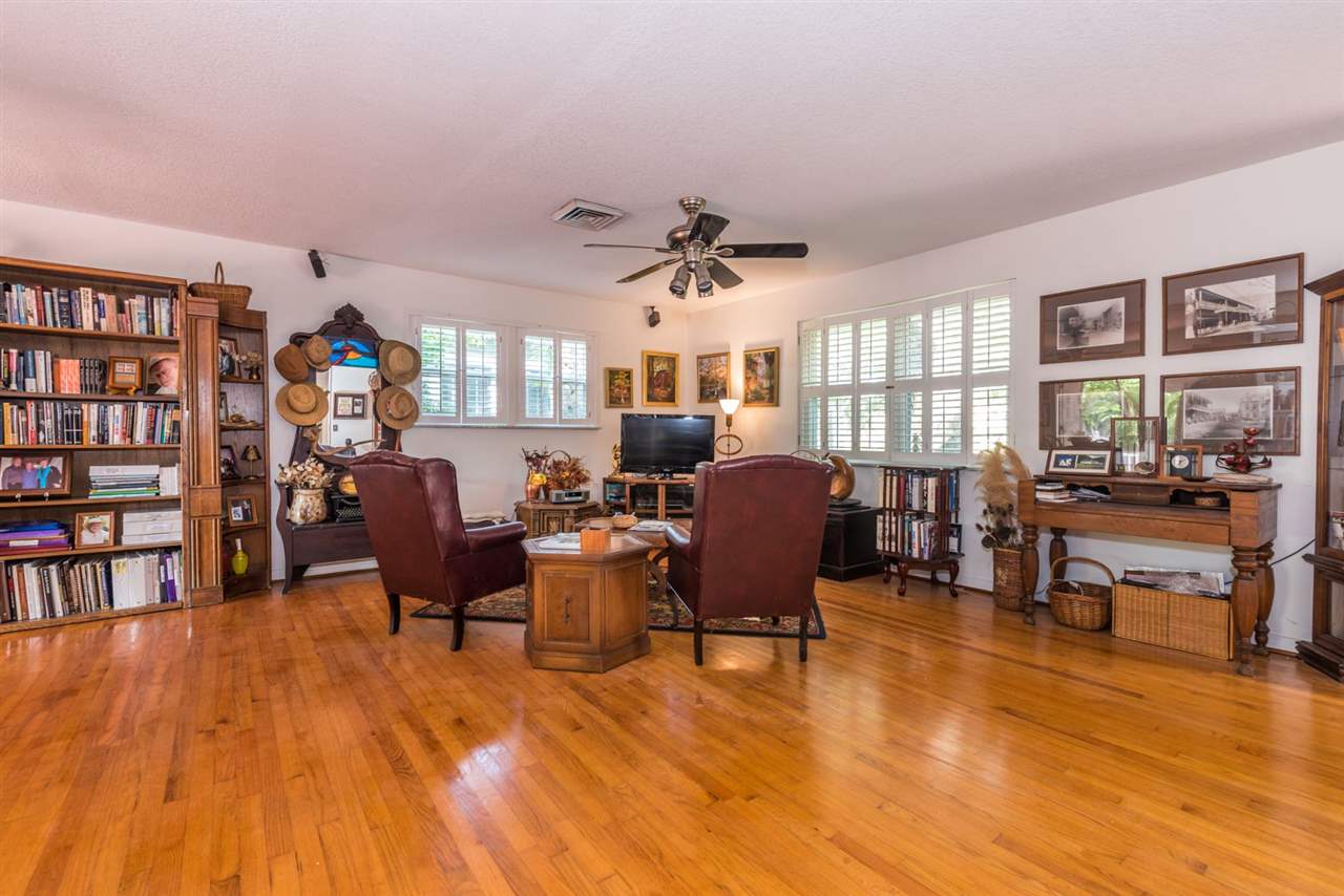71 Valencia Street St. Augustine, FL 32084 - Photo 10 of 43 a living room with fireplace furniture and a book shelf