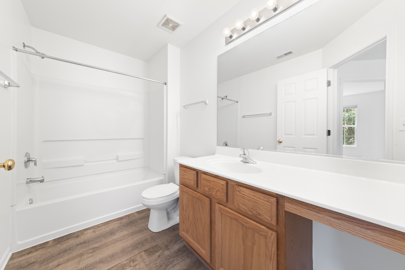 276 South Oak Creek Lane Romeoville, IL 60446 - Photo 18 of 21 a bathroom with a sink and a mirror
