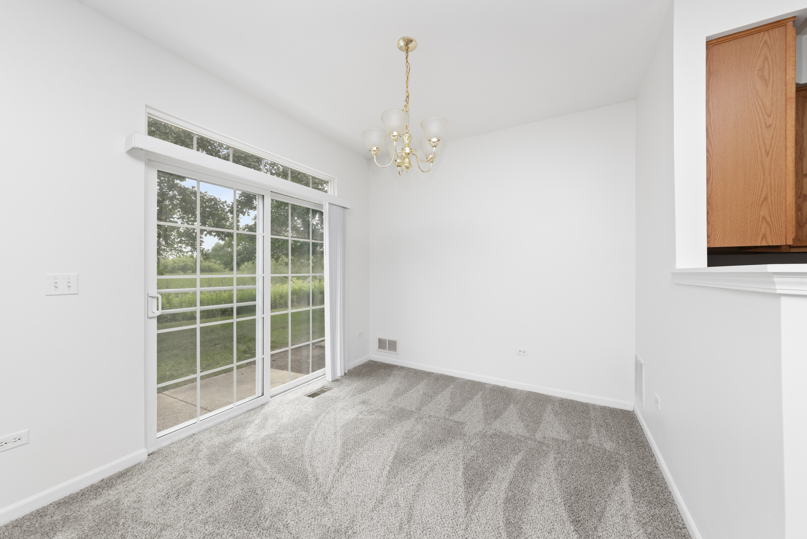 276 South Oak Creek Lane Romeoville, IL 60446 - Photo 8 of 21 a view of an empty room with a window
