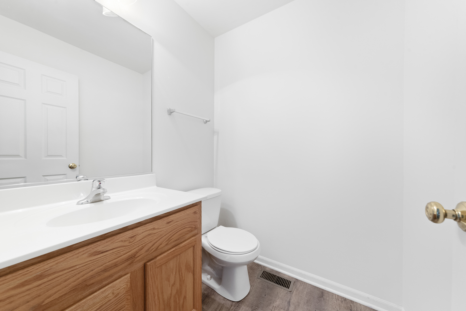 276 South Oak Creek Lane Romeoville, IL 60446 - Photo 9 of 21 a bathroom with a sink a toilet and a mirror