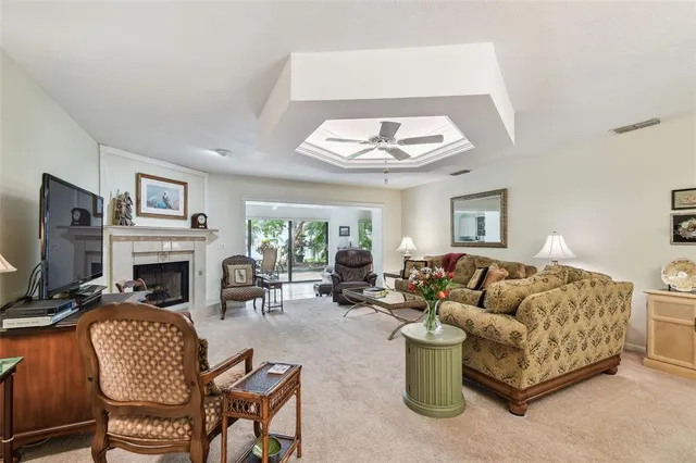 a living room with a fireplace and a rug
