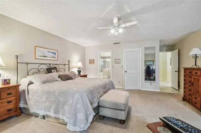a bathroom with a shower and a glass door
