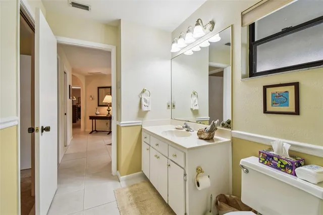 a view of a chairs and bench in a backyard