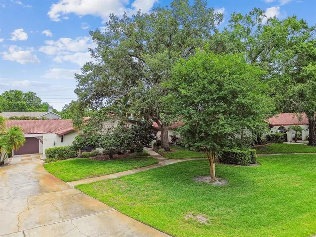 an aerial view of residential house with outdoor space and street view