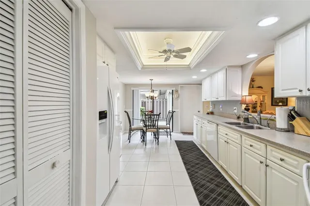 a kitchen with a sink stainless steel appliances and cabinets