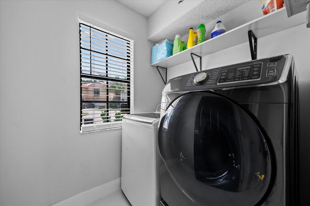 1779 Harborside Circle Wellington, FL 33414 - Photo 20 of 23 a close up of a washer and dryer