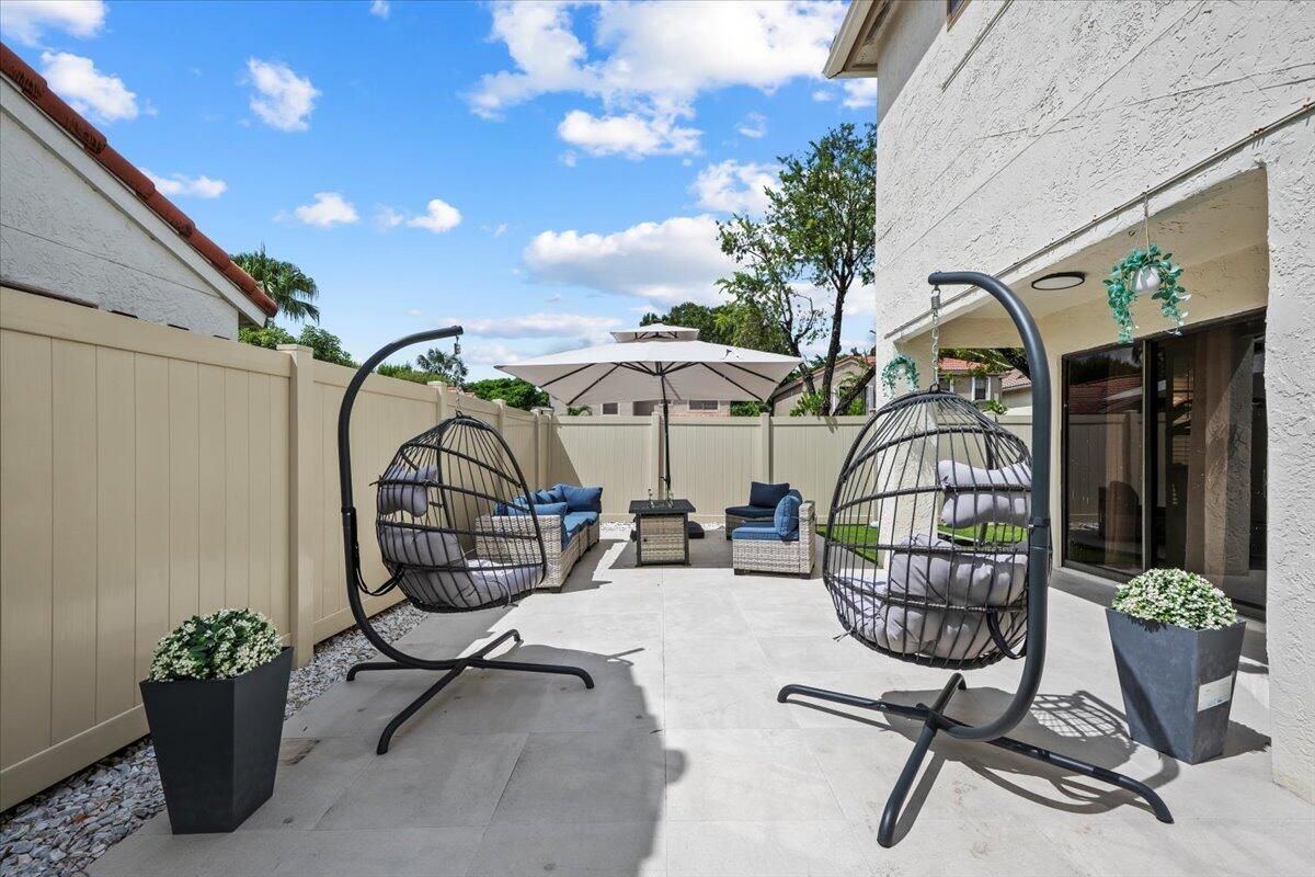 1779 Harborside Circle Wellington, FL 33414 - Photo 21 of 23 a view of a swimming pool with furniture