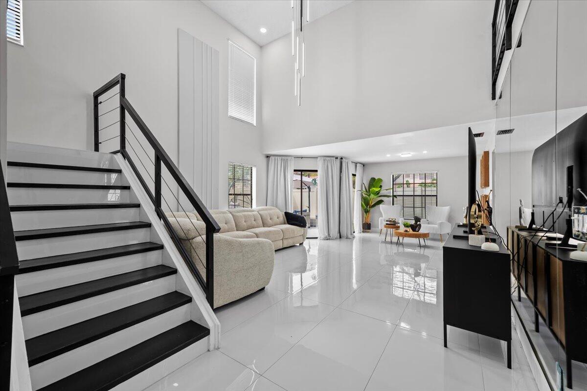 1779 Harborside Circle Wellington, FL 33414 - Photo 3 of 23 a view of a livingroom with furniture and hardwood floor