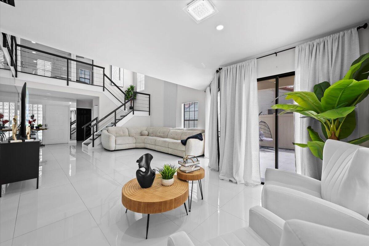 1779 Harborside Circle Wellington, FL 33414 - Photo 5 of 23 a living room with furniture and a potted plant