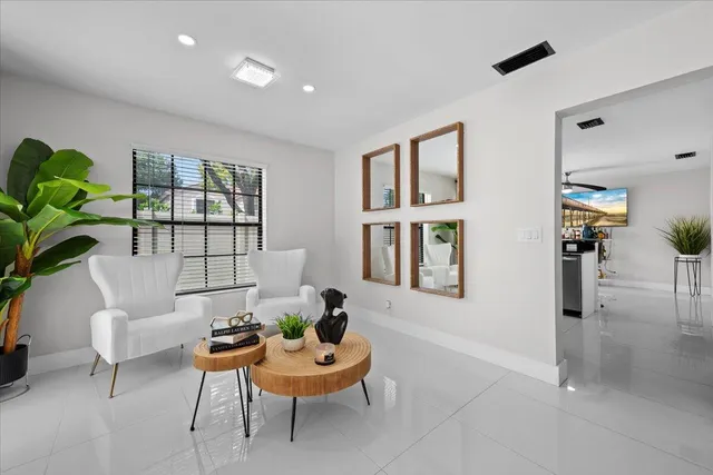 a living room with furniture and a window