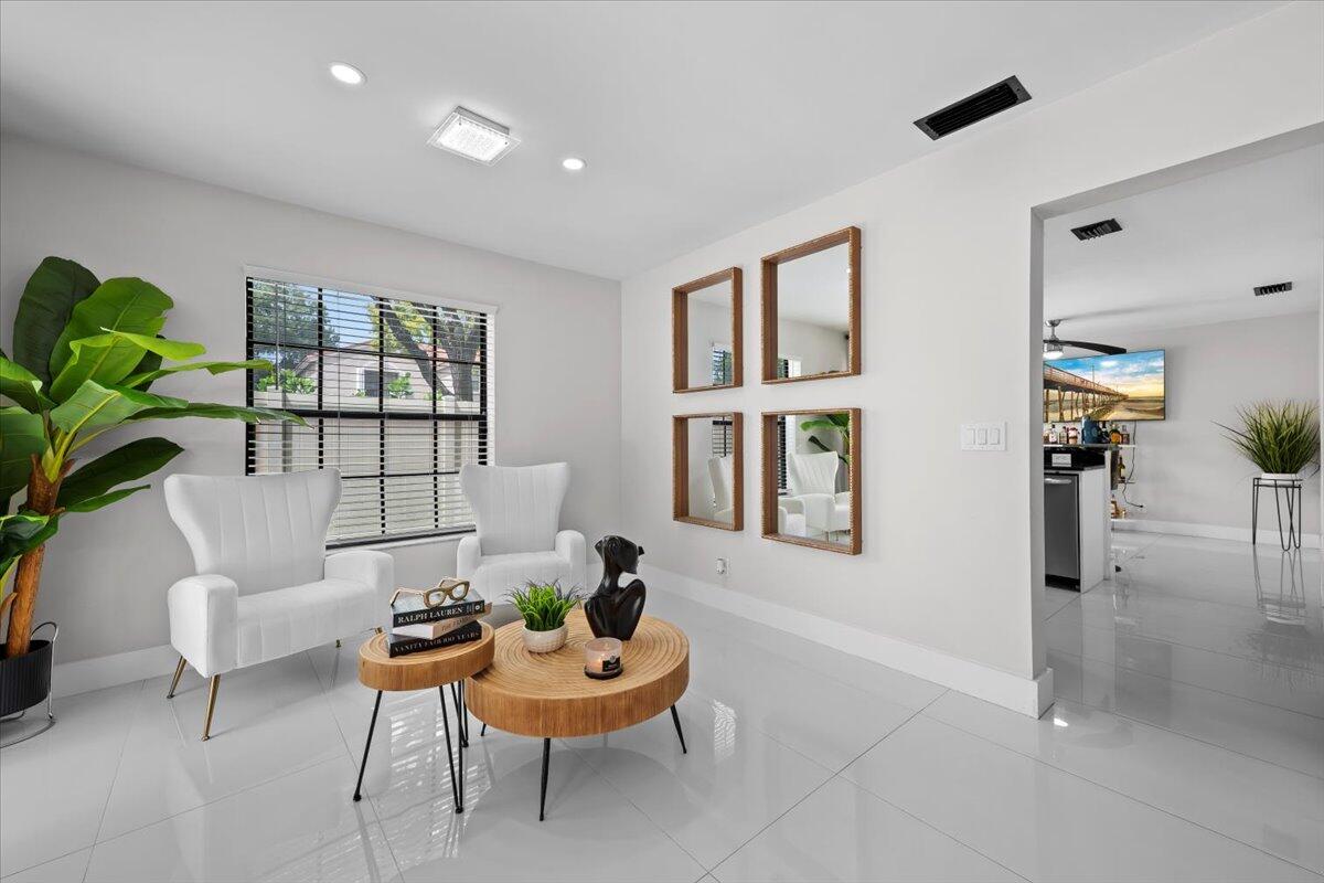 1779 Harborside Circle Wellington, FL 33414 - Photo 6 of 23 a living room with furniture and a window