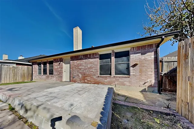 a front view of a house with yard