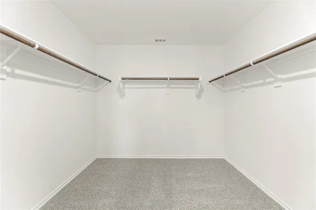 a view of an empty walk in closet