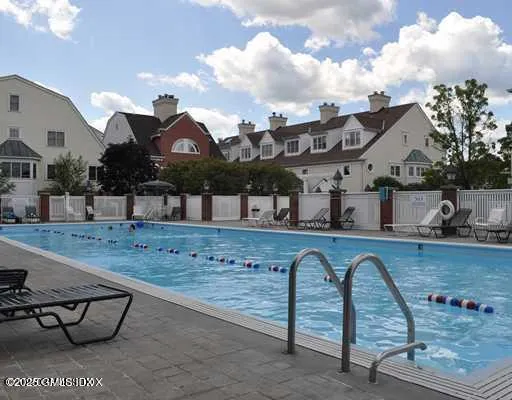 a view of a swimming pool with a yard