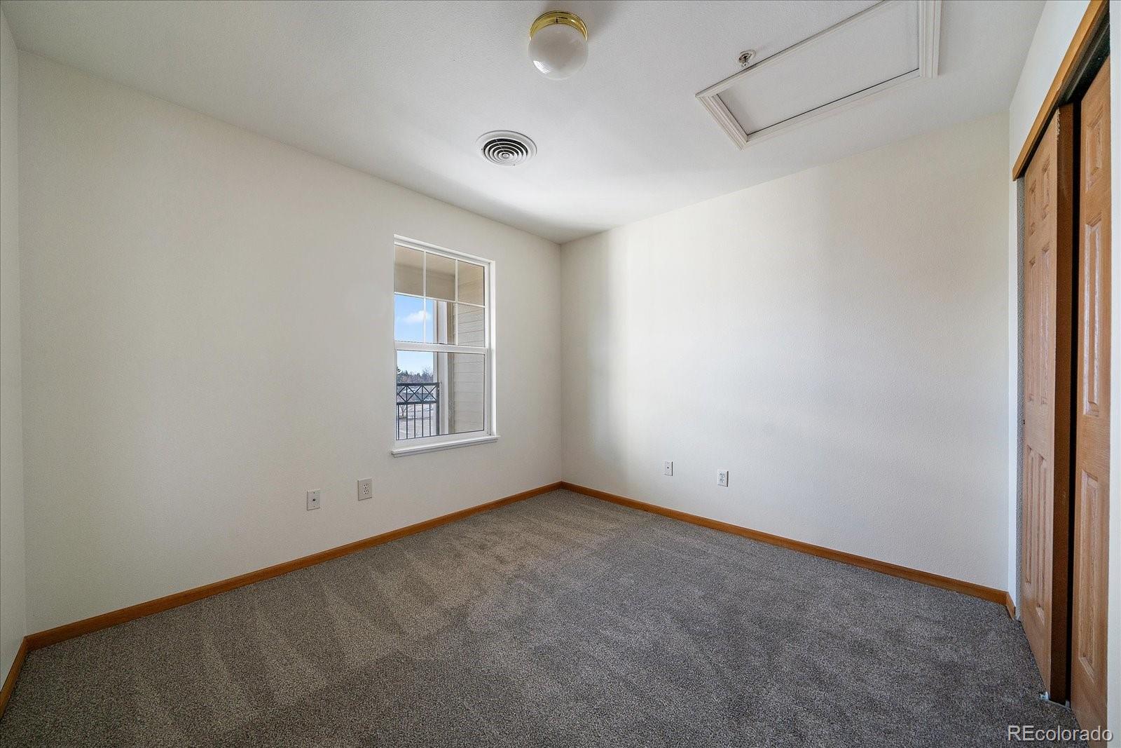 2226 West Elizabeth Street, Unit D302 Fort Collins, CO 80521 - Photo 15 of 20 an empty room with windows