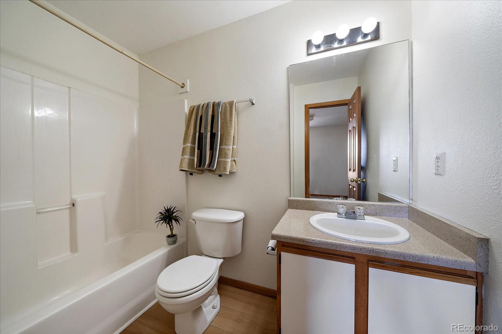 2226 West Elizabeth Street, Unit D302 Fort Collins, CO 80521 - Photo 16 of 20 a bathroom with a sink toilet and shower