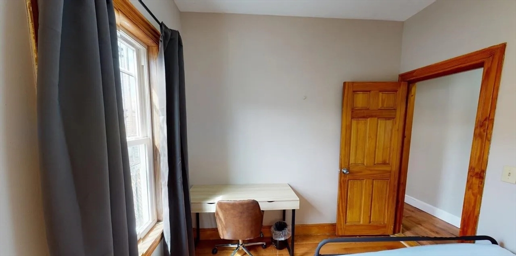 6 Cawfield Street, Unit 3 Boston, MA 02125 - Photo 3 of 9 a view of a room with gym equipment