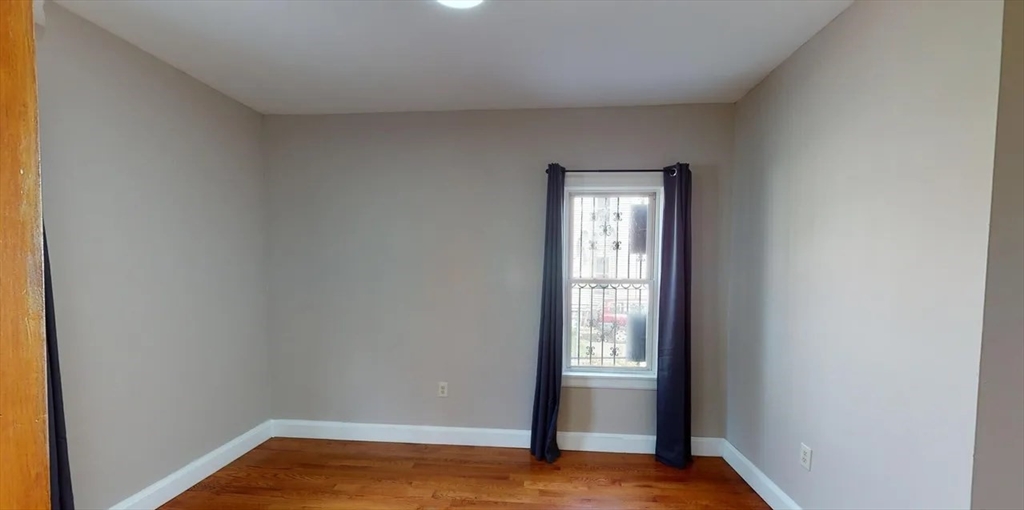 6 Cawfield Street, Unit 3 Boston, MA 02125 - Photo 4 of 9 a view of empty room with window